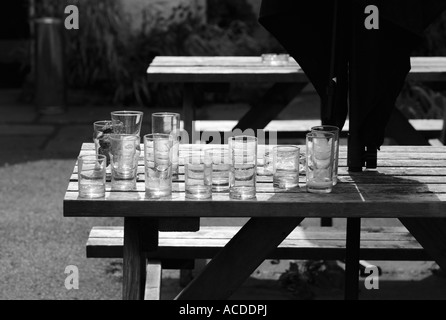 Many empty glasses outside a bar. Stock Photo