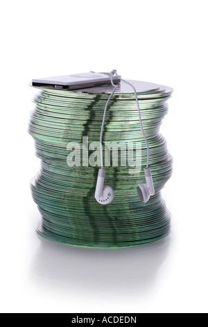 Stack of CDs with MP3 player on top cut out on white background Stock Photo
