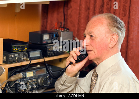 Blind man indulging his hobby for amateur radio London UK Stock Photo