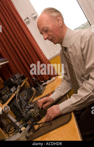 Blind man indulging his hobby for amateur radio London UK Stock Photo