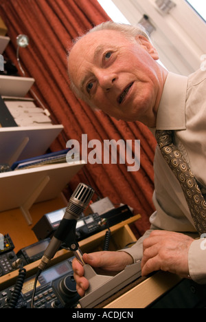 Blind man indulging his hobby for amateur radio London UK Stock Photo