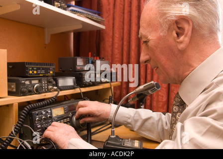 Blind man indulging his hobby for amateur radio London UK Stock Photo