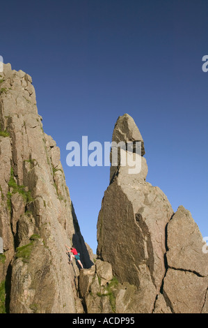 man climbing next to Napes Needle Great Gable Lake District Stock Photo