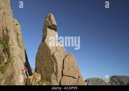 man climbing next to Napes Needle Great Gable Lake District Stock Photo