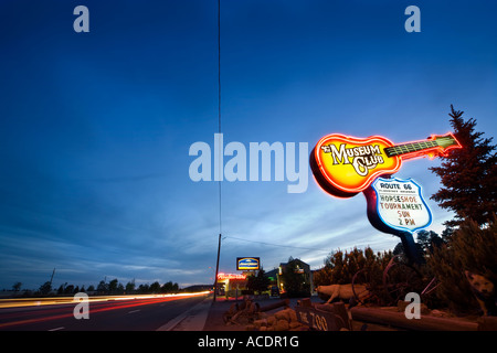 Route 66 in Flagstaff Arizona. Landmark neon sign of the world famous Museum Club Roadhouse at night with light streaks Stock Photo