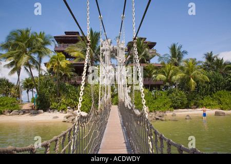 Wooden rope suspension bridge from Palawan beach across lagoon to southern most point of Asia. Sentosa Island Singapore Stock Photo