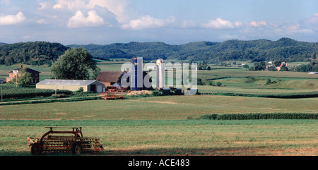 Wisconsin dairy farm showing red barn fence silo windmill and ...