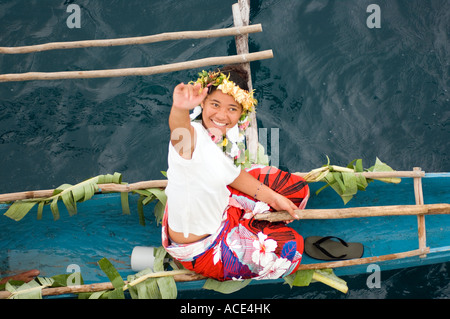 native Fijian girl in dugout canoe welcomes visitors Kioa Island Fiji Stock Photo