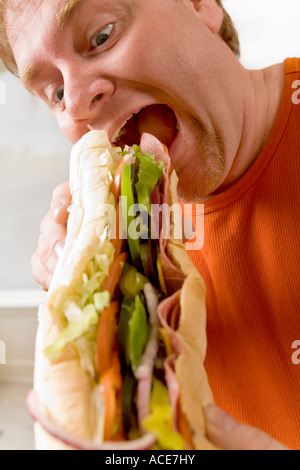 Man eating a sandwich Stock Photo