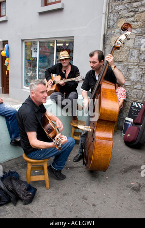 Group of musicians busking in street at Irish traditional music festival, County Kerry, Ireland Stock Photo