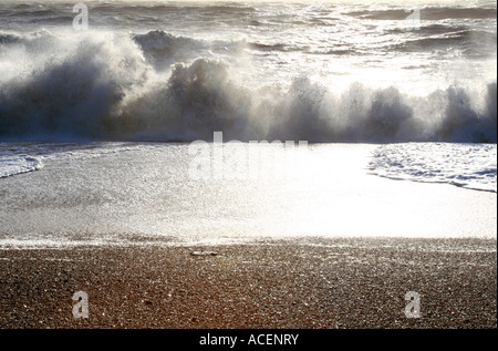 Breaking waves on Burton Bradstock beach Dorset Stock Photo