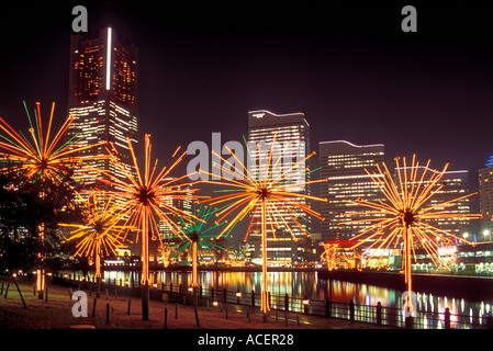 Electric fireworks display in park across bay from MM21 (Minato Mirai 21) office hotel and retail complex in Yokohama, Japan. Stock Photo
