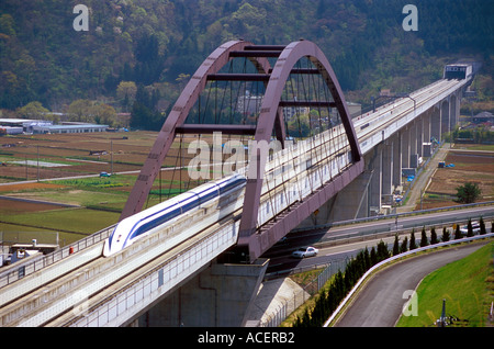 Prototype MagLev train zooming along a test track in Yamanashi Prefecture Japan Stock Photo