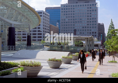 Business people walking to work on a sunny day in the Sakae district of Nagoya Stock Photo
