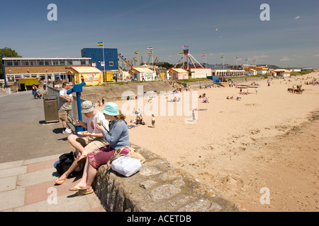 Wales Glamorgan Porthcawl people on Eastern Promenade above Sandy Bay beach and Coney Beach funfair Stock Photo