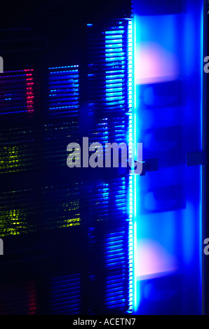 Neon glow from a rack mounted data network server at night Stock Photo