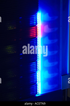 Neon glow from a rack mounted network server at night Stock Photo