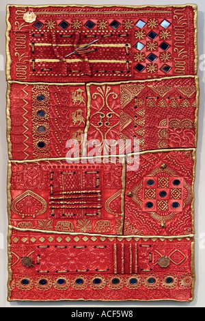 Ceramic hand made studio art pottery UK English clay pot pottery glaze glazed art unique gold orange red fabric textile asian Stock Photo