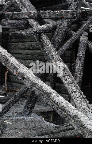 burned down black charred timber rafters and exposed roof structure ...