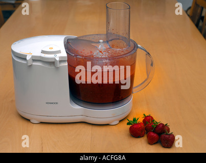 Sorbet Making Strawberries Being Pureed in Blender with Water Ice Stock Photo