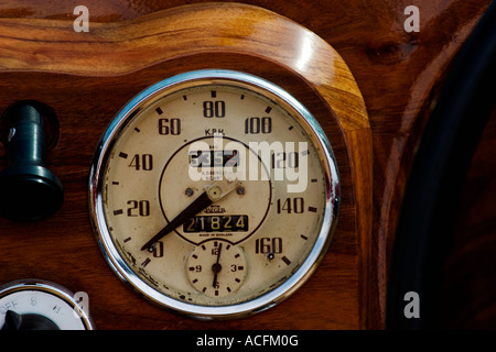 Speedometer in a wooden dashboard Stock Photo