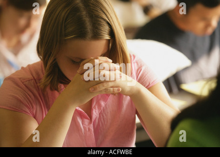 Woman praying Stock Photo