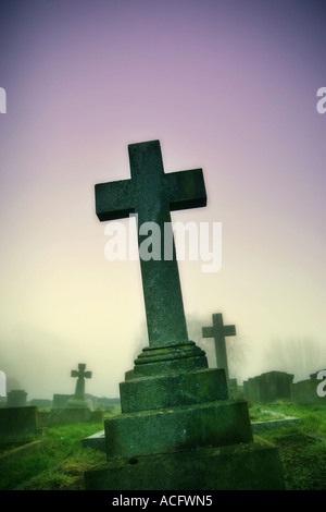 Photo of a cross in a graveyard Stock Photo