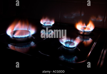 Natural gas flames on kitchen cooker hob Stock Photo