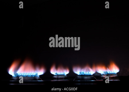 Natural gas flames on kitchen cooker hob Stock Photo