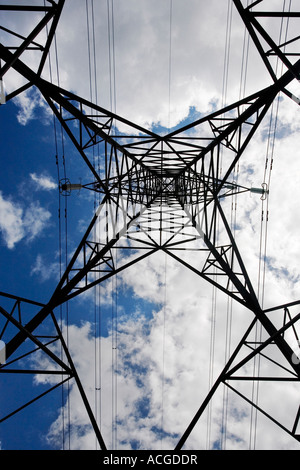 Electricity pylon abstract against blue sky and clouds Stock Photo