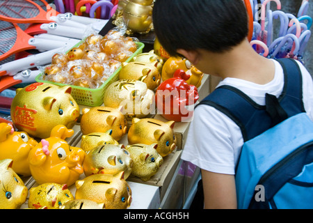 Young Korean Boy Buying Piggy Bank to Save Money in Myeongdong Market Seoul South Korea Stock Photo