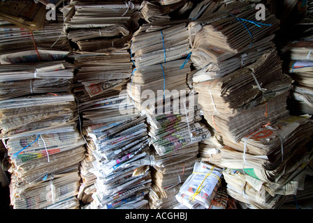 RECYCLING BALES OLD NEWSPAPERS Piled up bundles of old newspapers waiting for recycling Stock Photo