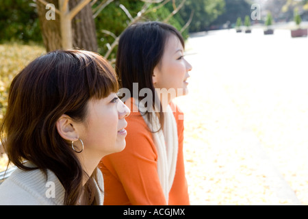 Two young women side view Stock Photo