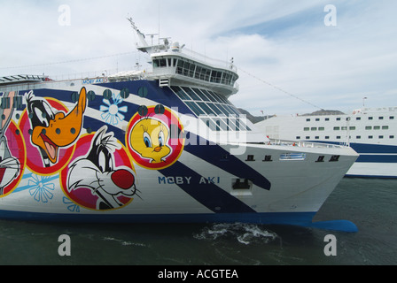 Olbia Sardina port the bow of Moby Lines Aki ferry with colourful artwork depicting cartoon characters Italy Stock Photo