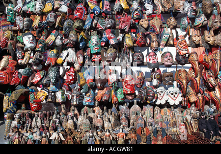 Colourful wooden masks from Nahuala for sale at Chichicastenango market Guatemala Stock Photo