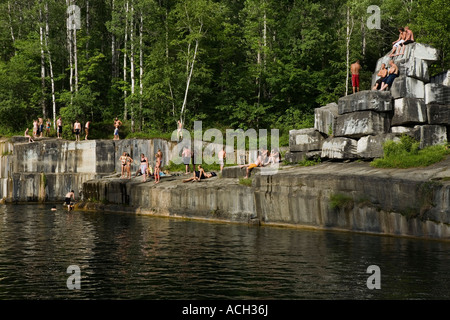 Teens swimming in former Dorset marble quarry oldest in USA Rutland County Vermont Stock Photo