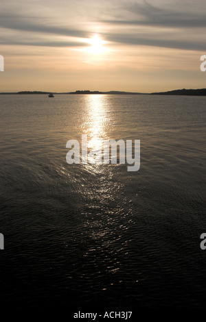 View of Sea at mouth of Poole Harbour towards Brownsea Island from Studland Ferry to Sandbanks Poole Dorset Stock Photo