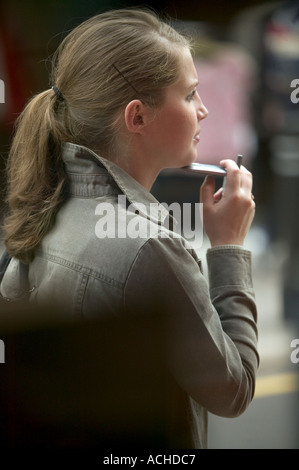 woman holding mobile phone Stock Photo