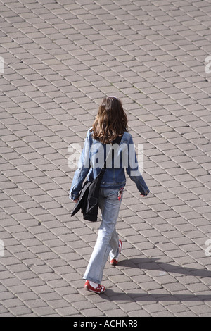 Girl with bag on the way home Stock Photo