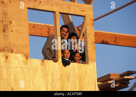 African American family in their new house being built Stock Photo
