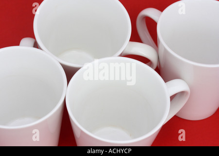 TOP VIEW WHITE COFFEE CUPS RED BACKGROUND HORIZONTAL BDB11041 Stock Photo