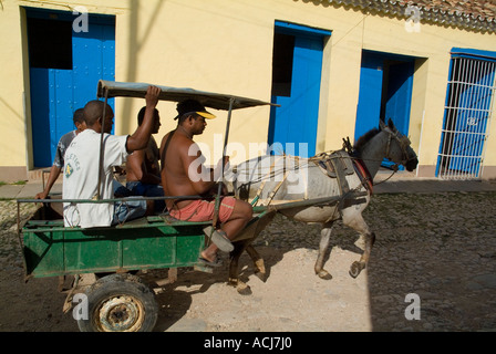 Horse pulling a taxi cart full of passengers in the streets of Trinidad, Cuba. Stock Photo
