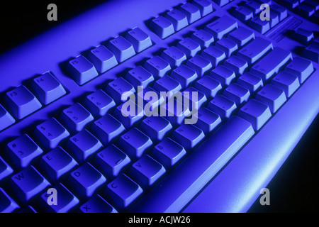 Computer keyboard product shot under blue light. Stock Photo
