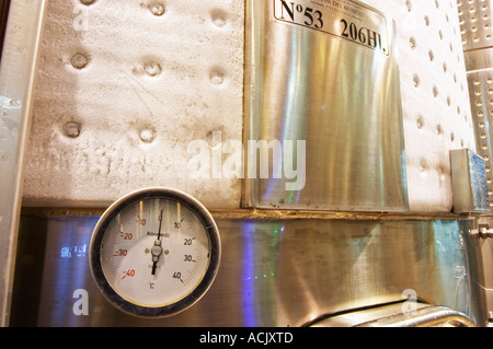a tank with a temperature control shielding cooled with sub zero liquid so that there is frost ice on the outside of the tank. thermometer showing one degree above zero centigrade Bodega Del Fin Del Mundo – The End of the World - Neuquen, Patagonia, Argentina, South America Stock Photo
