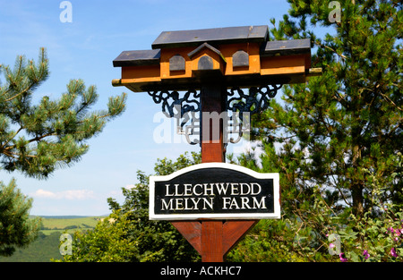 Rustic farm sign in the Welsh countryside near Aberaeron Ceredigion West Wales UK Stock Photo