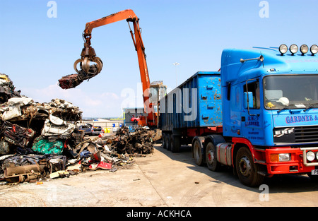 Compacted cars ready for recycling in scrapyard at Newport Docks South ...
