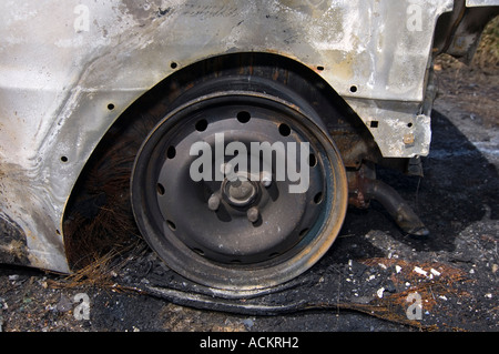 Burnt out car abandoned by car thieves in the UK Stock Photo