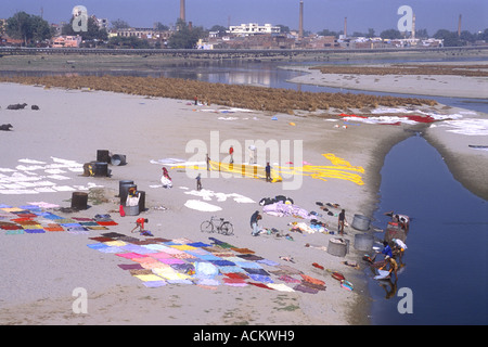 Laundry spread out to dry in the hot sunshine on the sandy banks of the Yamuna River Agra Uttar Pradesh India Stock Photo