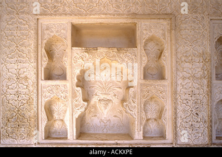 Beautiful detail of carved plaster work niches inside the Amber Fort or Palace near Jaipur Rajasthan India Stock Photo