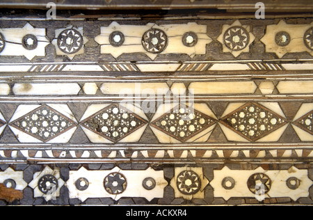 Beautiful detail of inlaid wood and ivory inside the Amber Fort or Palace near Jaipur Rajasthan India Stock Photo
